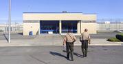 Officers walk toward the entrance to Nevada's Lovelock Correctional Center in Lovelock