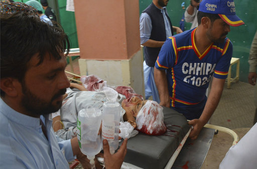 Volunteers rush an injured person to a hospital in Quetta