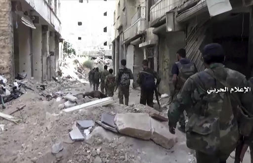 In this still image taken from video provided by the Syrian government-controlled Syrian Central Military Media