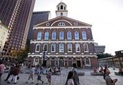 Pedestrians pass Faneuil Hall