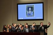 Bidding representatives react after Leonardo da Vinci's "Salvator Mundi" sold for $400 million at Christie's