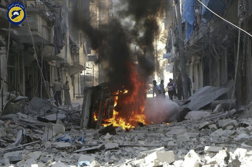 In this photo provided by the Syrian Civil Defense group known as the White Helmets