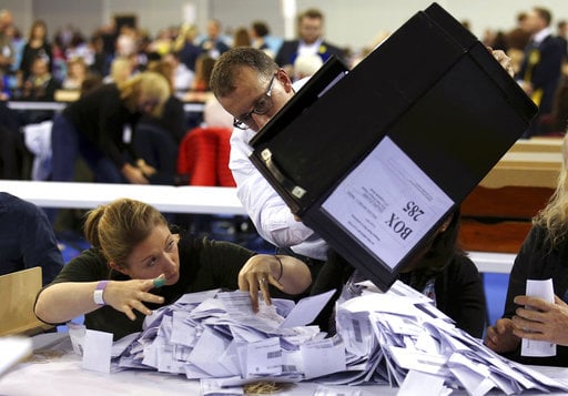 Ballot boxes are emptied to be counted for the general election