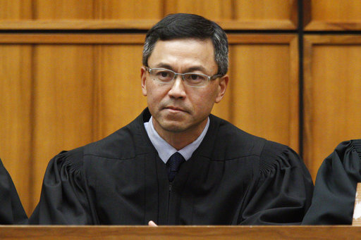 FILE - This Dec. 2015 file photo shows U.S. District Judge Derrick Watson in Honolulu. Watson on Thursday