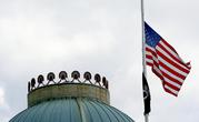 The United States flag flies at half-staff over the state Capitol in Raleigh