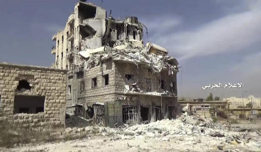 In this still image taken from video provided by the Syrian government-controlled Syrian Central Military Media