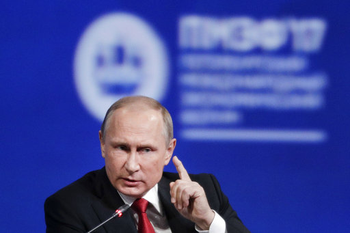 Russian President Vladimir Putin gestures as he speaks at the St. Petersburg International Economic Forum in St.Petersburg