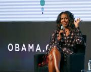 Former first lady Michelle Obama responds to a question from poet Elizabeth Alexander during the second day of the Obama Foundation Summit Wednesday
