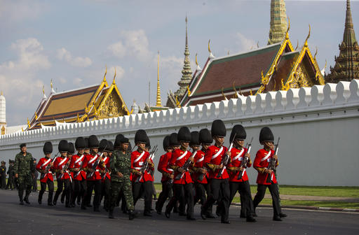 Thai Royal Guard march outside the Grand Palace Friday