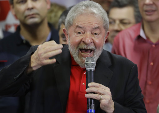 Former Brazilian President Luiz Inacio Lula da Silva delivers a brief speech to the media and supporters at the headquarters of the Worker's Party in Sao Paulo