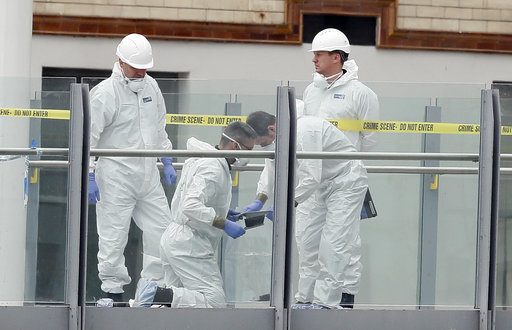 Forensic officers work near the Manchester Arena in Manchester