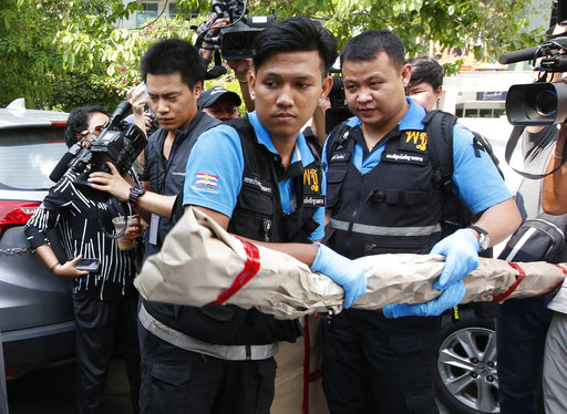 Thai forensic officers carry out collected evidence from Phramongkutklao Hospital