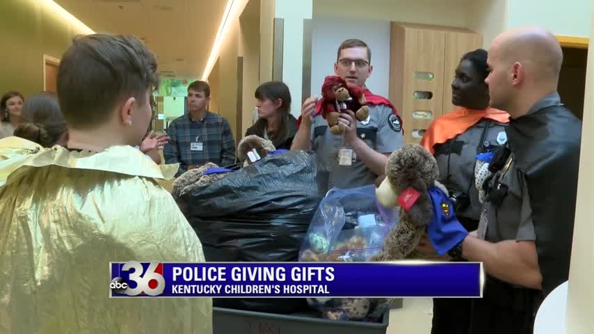 UK Police and Security Officers wear superhero capes and deliver gifts to patients at Kentucky Children's Hospital 5-12-17