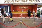 Patrons stand in line and purchase tickets to the Dreamland Wax Museum Monday