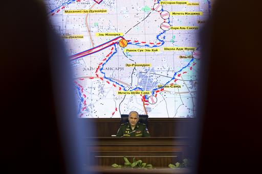 Lt. Gen. Sergei Rudskoi of the Russian military's General Staff speaks in front of a map of the Aleppo area