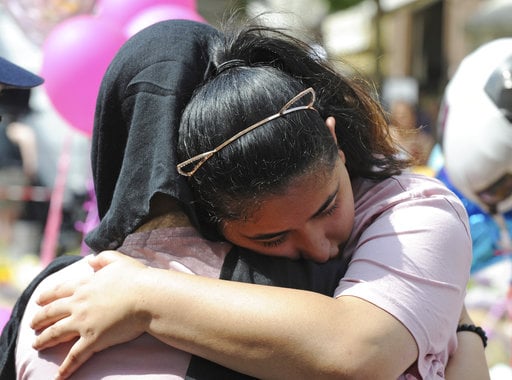 A member of the public reacts at St Ann's Square in central Manchester