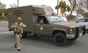 A sheriff's hostage negotiation team passes a California highway patrol checkpoint at the Veterans Home of California in Yountville