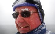 Snow accumulates on Paul Knight's eyebrows as he walks during a nor'easter