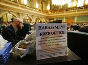 A sign sits on the filing cabinet next to Colorado State Rep. Jonathan Singer