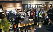 Demonstrators occupy the Starbucks that has become the center of protests Monday