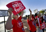 Teachers at Humphrey Elementary school participate in a state-wide walk-in prior to classes Wednesday