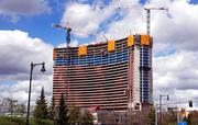 Construction cranes tower over the Wynn Resorts casino site in Everett
