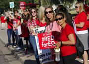 Teachers from Highland Arts Elementary School stage a final walk-in Wednesday