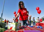 Teacher Jennifer Galluzzo casts her ballot outside Paseo Verde Elementary Wednesday