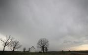 A line of thunderstorms pass over a barn near Baldwin City