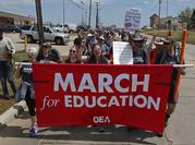 Demonstrators walk along NE 36th St. in the final leg of a 110 miles trip from Tulsa to the state Capitol as protests continue over school funding