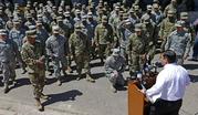 Arizona Gov. Doug Ducey speaks to Arizona National Guard soldiers prior to deployment to the Mexico border at the Papago Park Military Reservation Monday