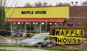 Police tape blocks off a Waffle House restaurant Sunday