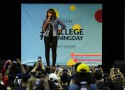 Former first lady Michelle Obama smiles while speaking at College Signing Day