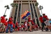 Teachers rally outside of Arizona Gov. Doug Ducey's Executive Tower Monday