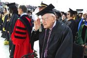 World War II veteran Bob Barger stands during the national anthem at the commencement ceremony at the University of Toledo