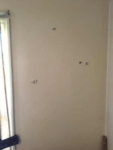 Bullet holes in apartment in Laurel County