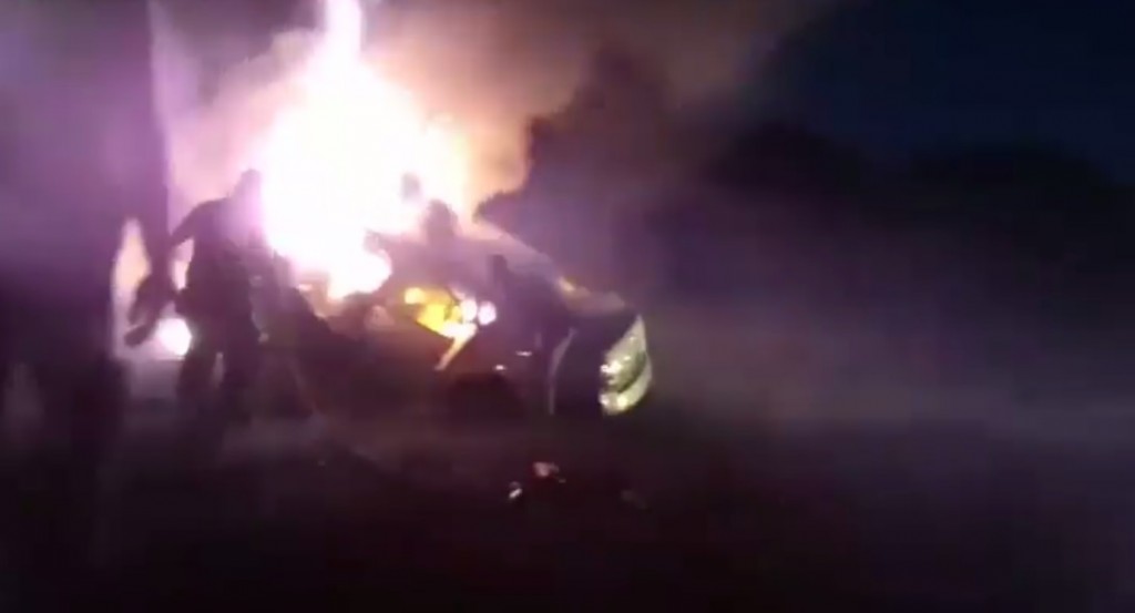 First responders try to rescue a man trapped in a burning car on I75.