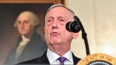 PHOTO: President Donald Trump looks on as Secretary of Defense James Mattis speaks about the spending bill during a press conference in the Diplomatic Reception Room at the White House on March 23, 2018.