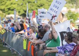 People protest in Murray where incoming NRA president Oliver North was a featured speaker at a GOP fundraiser 8-3-18.  Courtesy of the Paducah Sun