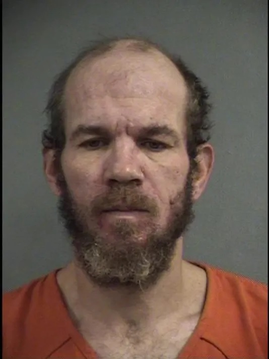 Accused of setting tent on fire with a homeless man inside in Louisville