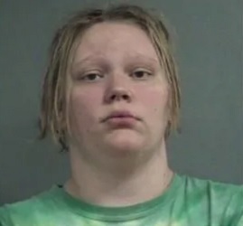 Accused of beating and burning an autistic man who befriended her.