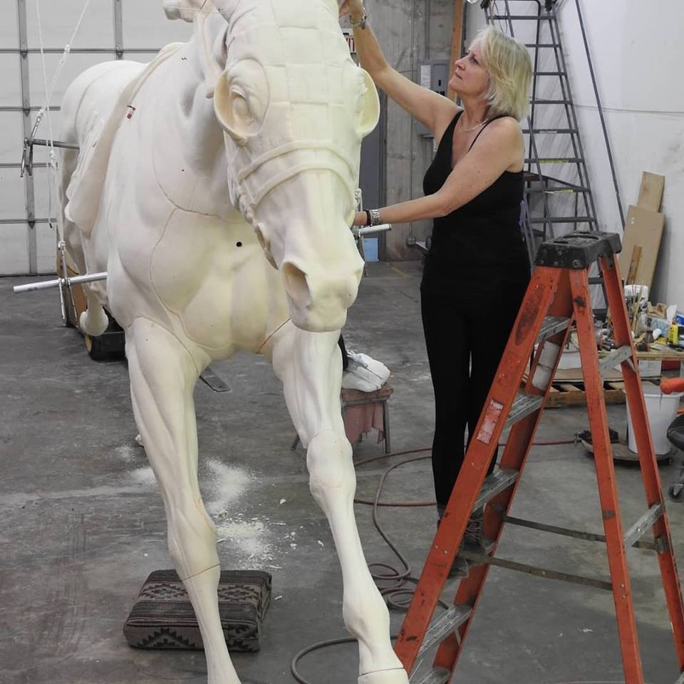 Sculptor Jocelyn Russell working on Secretariat statue.