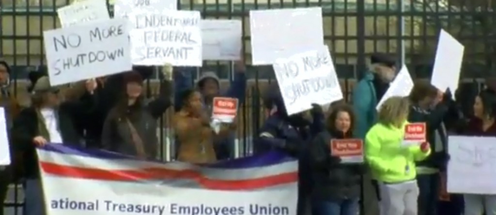 Federal employees demonstrate outside the IRS office in Covington