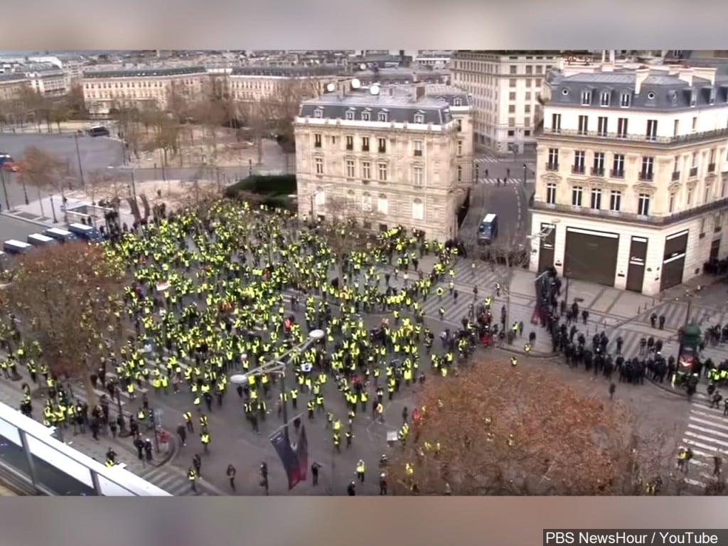 Thousands of people wearing yellow vests gathered at Champs-Elysees in Paris