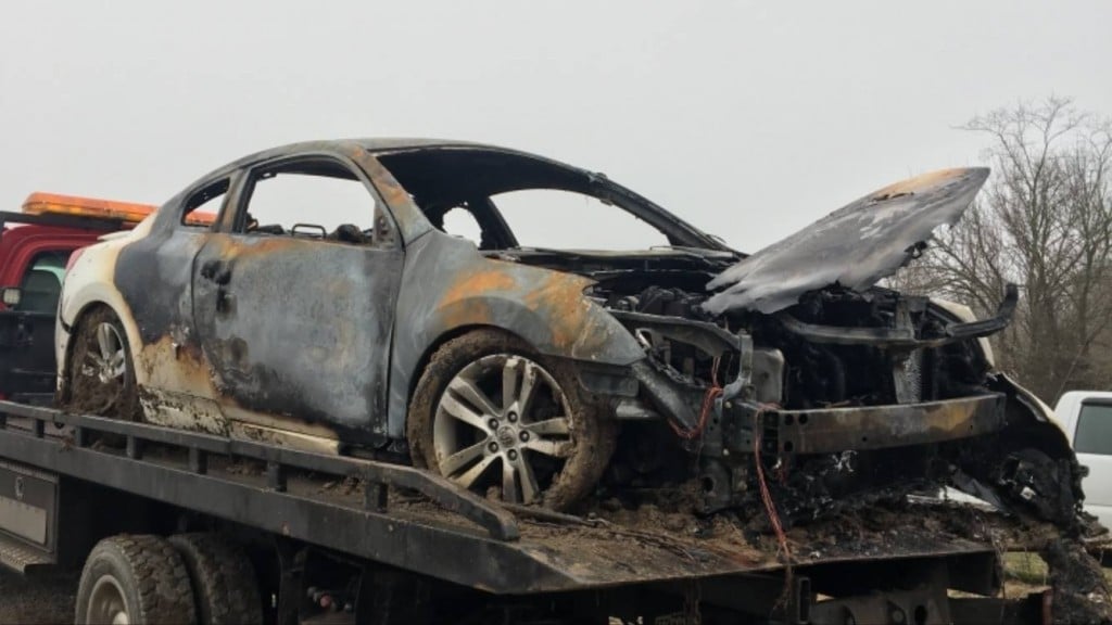 Lancaster Police pull driver from burning car.
