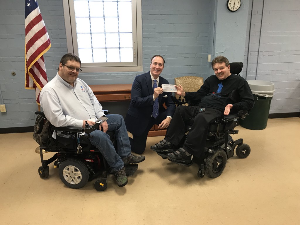 Kentucky-Indiana Chapter of the Paralyzed Veterans of America present check to Tom Kenny