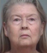 Prosecutors have dropped the charges against a woman accused of lying to a grand jury during an investigation into the fatal shootings of eight people.