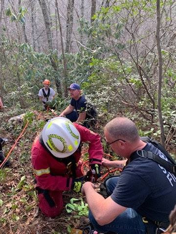 Rescues pull a man up from a 75-foot cliff.