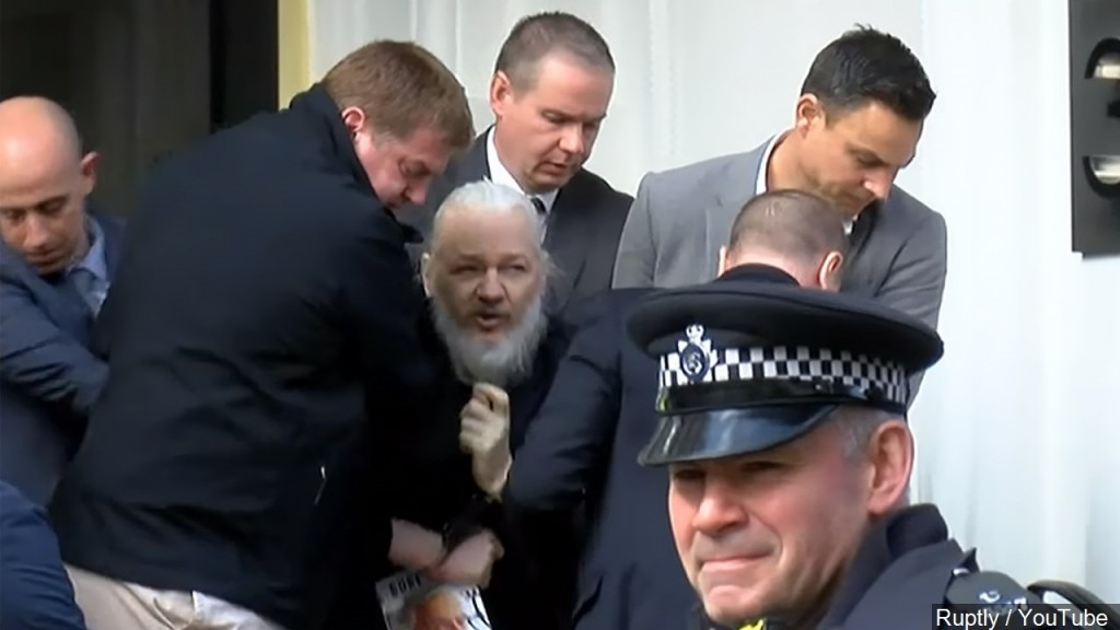 Wikileaks founder being taken into custody.