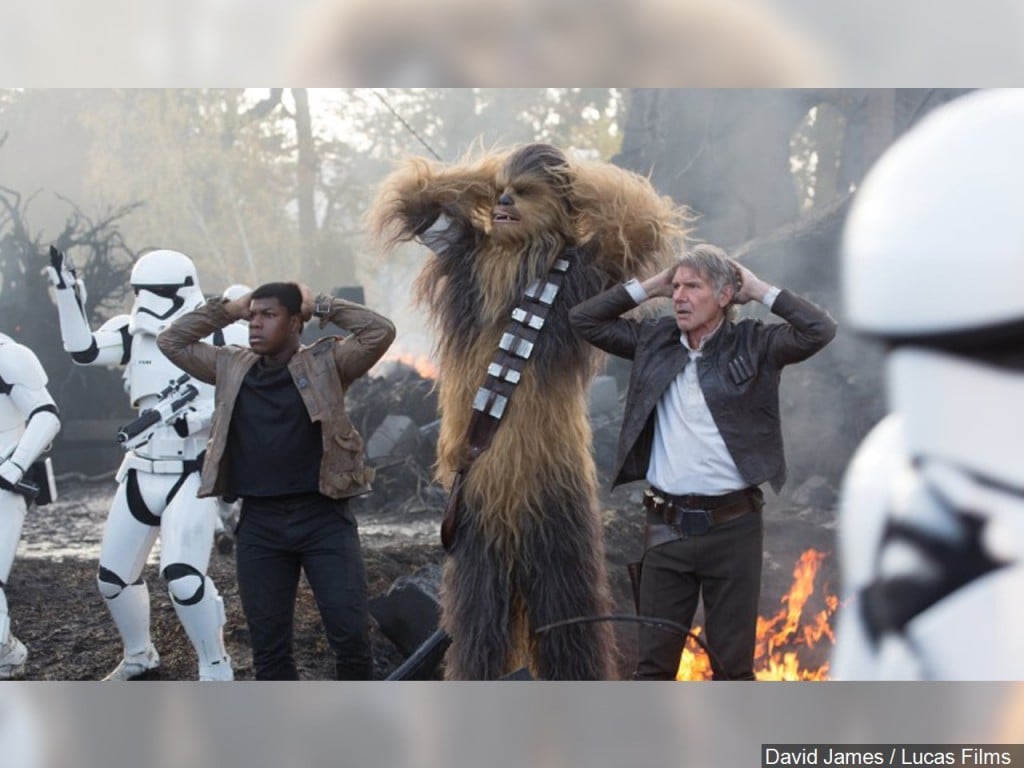 Star Wars: The Force Awakens (L to R) John Boyega (Finn) Peter Mayhew (Chewbacca) and Harrison Ford (Han Solo)